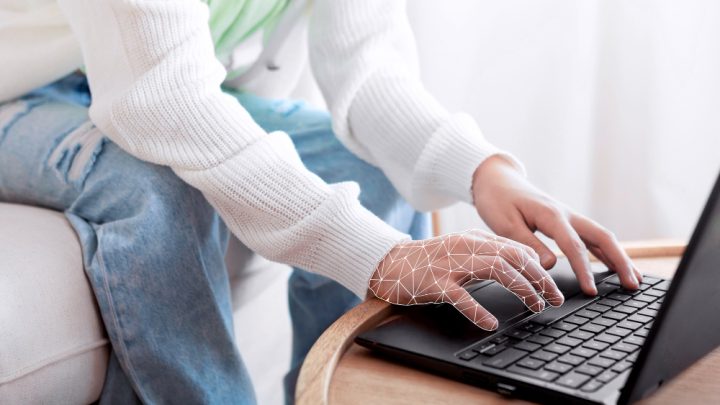 Hand holding human silhouette with text: 'Machine Translation Affects the Translator Job'